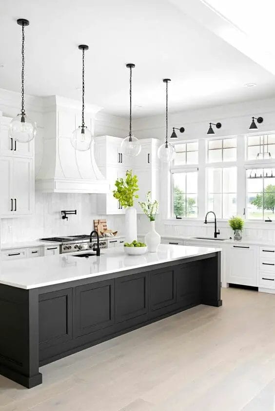 Photo of a modern farmhouse kitchen design. White and black with an island.