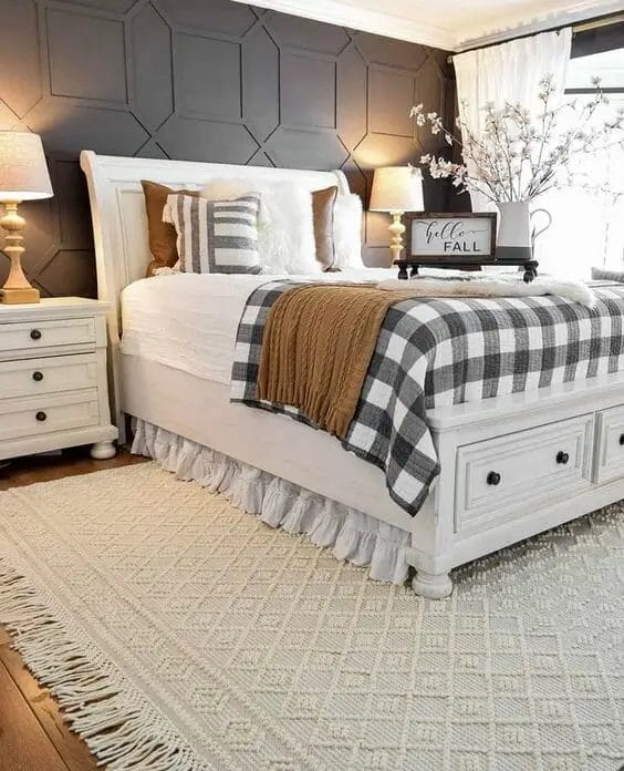 Photo of a farmhouse bedroom design with a black accent wall.
