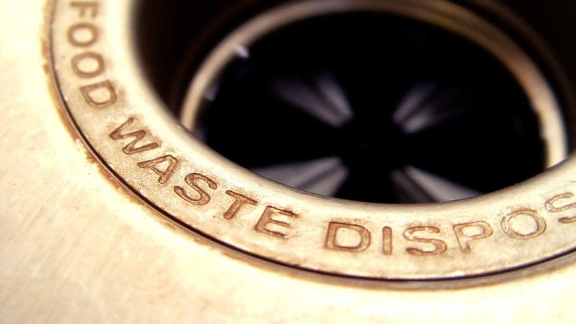 Photo closeup of a sink garbage disposal.