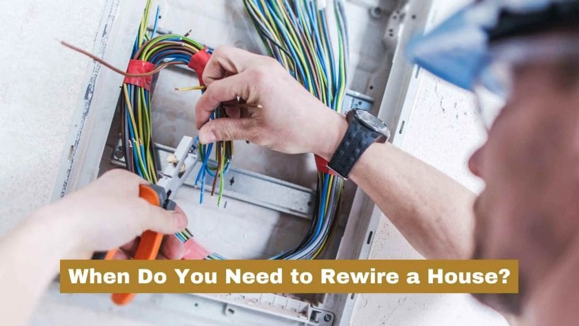 Photo of an electrician rewiring a house. When Do You Need to Rewire a House?