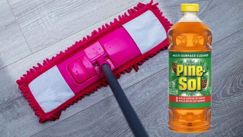 Photo of a Pine Sol bottle on top of laminate floor and a mop cleaning the floor.