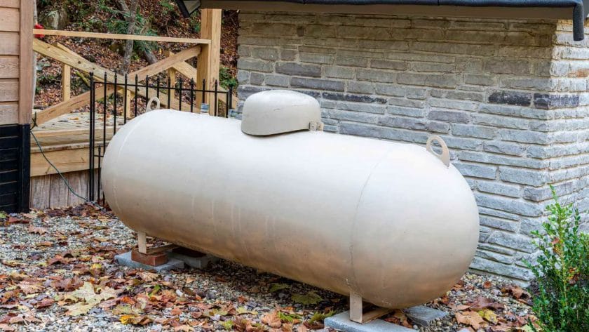 Photo of a big propane tank outside the house. Reasons To Why Your House Smells Like Propane But No Leak
